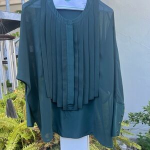 Sheer Emerald green poly top. Worn buttons on cuffs see pics